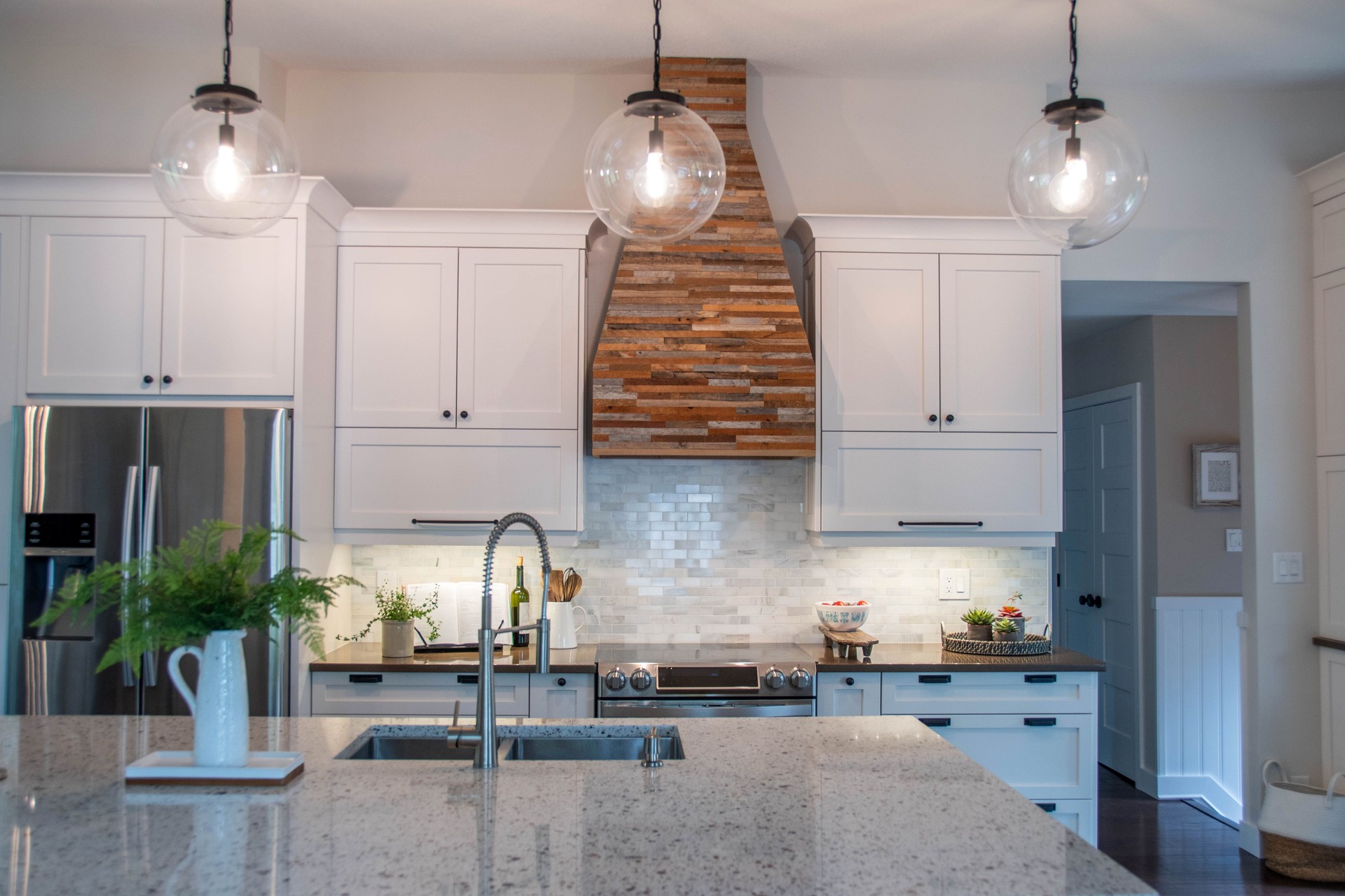 Modern country kitchen with reclaimed wood hood fan